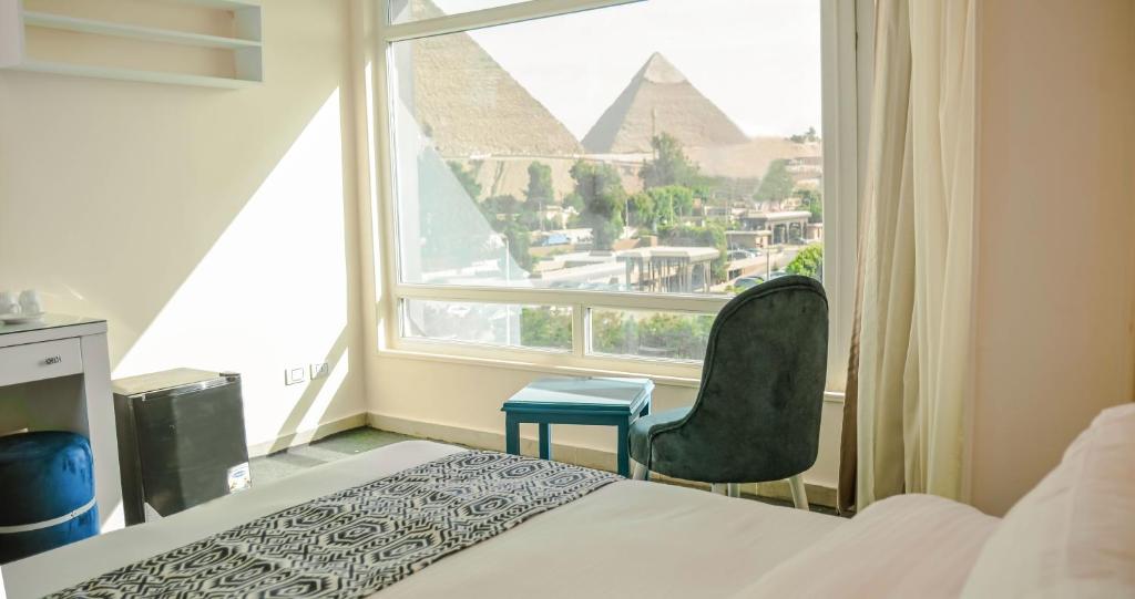 Turquoise Pyramids & Grand Egyptian museum view Hotel